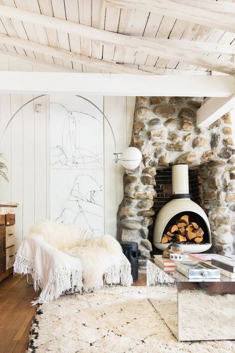 boho chic living room with white retro fireplace