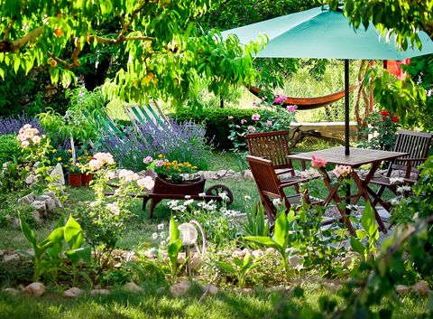 Wooden table and chairs in a beautiful garden