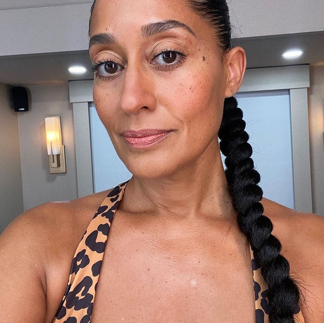 two people with workout hairstyles, one on the left with two high puffs, and on the right tracee ellis ross with a long braided ponytail