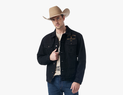 a man wearing a tan cowboy hat and black trucker jacket