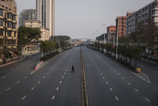 wuhan, china   february 03  china out a man cross an empty highway road on february 3, 2020 in wuhan, hubei province, china the number of those who have died from the wuhan coronavirus, known as 2019 ncov, in china climbed to 361 and cases have been reported in other countries including the united states, canada, australia, japan, south korea, india, the united kingdom, germany, france, and several others  photo by getty images