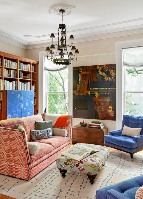 kathleen walsh living room, pink couch, blue chairs, cream walls, floral ottoman