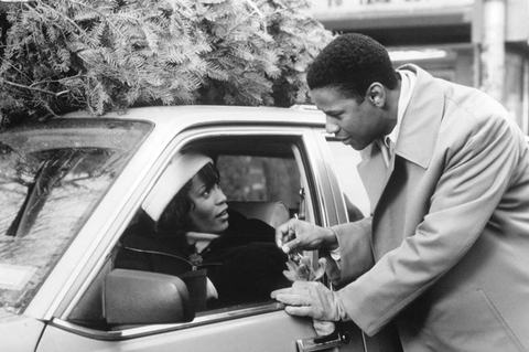 woman in car and man talking to her through window