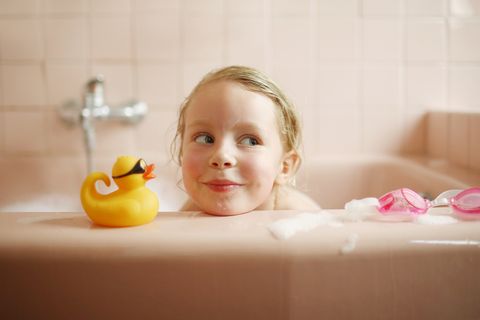 a 5 years old girl taking her bath