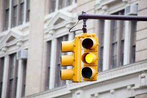 Yellow caution signal on traffic light