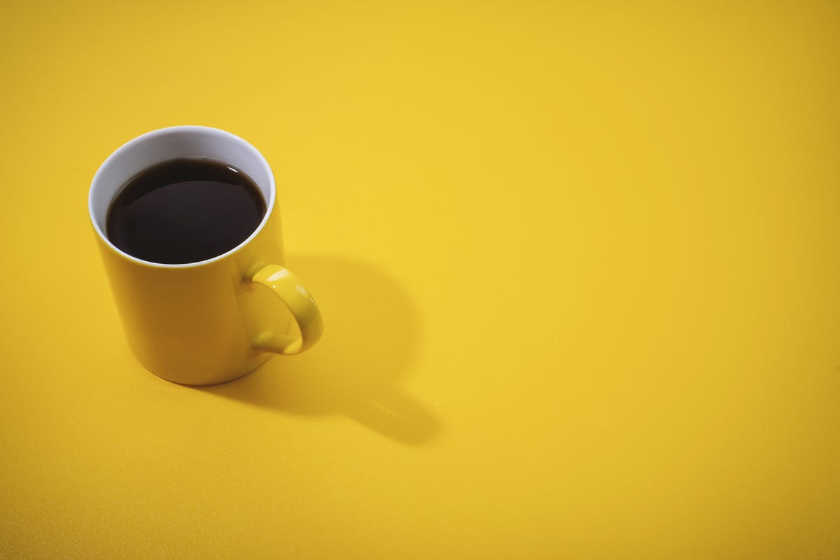 https://hips.hearstapps.com/hmg-prod.s3.amazonaws.com/images/yellow-coffee-mug-on-yellow-background-royalty-free-image-1598286817.jpg?crop=0.88847xw:1xh;center,top&resize=1200:*