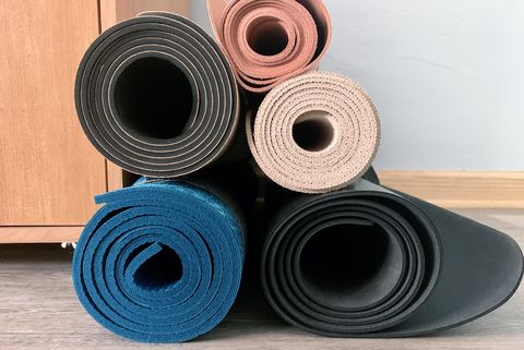 stack of rolled yoga mats