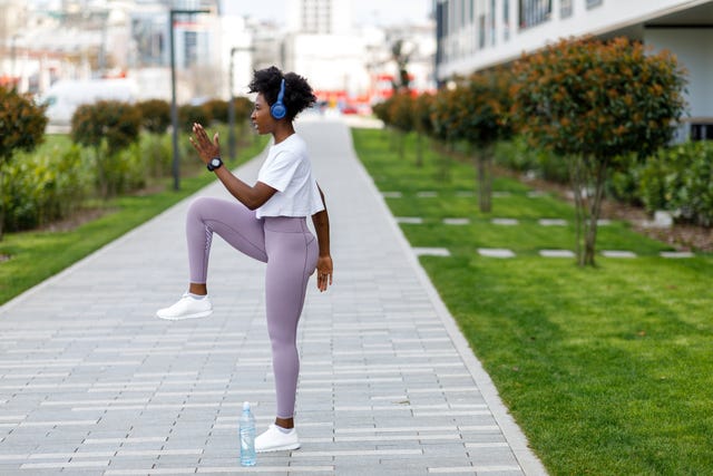Woman is Preparing for Work Out and Stretching Legs. woman is preparing for work out and stretching legs, hip mobility exercises
