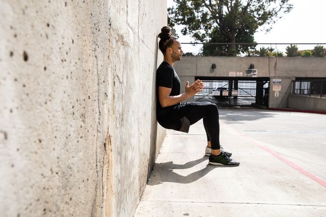 young afroamerican man getting fit in los angeles downtown city streets