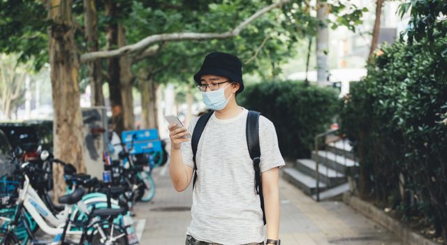 young asian man with protective face mask