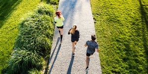 Young athtletes in the city running in park.