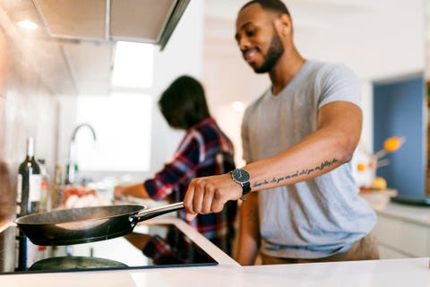 Young couple cooking together at home young couple cooking together at home
