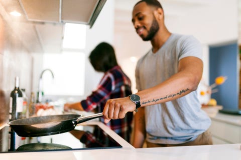 young couple cooking together at home