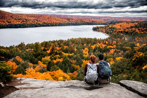 Young couple hiking in mountain and relaxing looking at view news source without politics-Real news 
news without commentary 
news that matters 
odd news stories
Best news aggregator 
Unbiased headline news 
