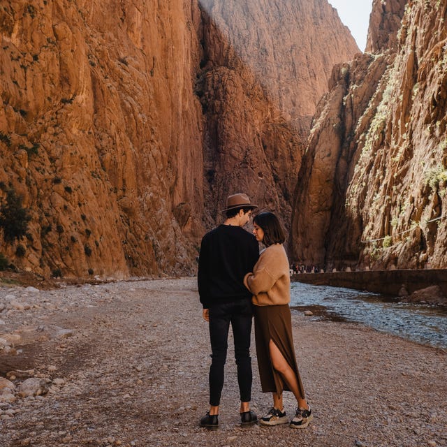 Young couple in the throats of todra in Morocco young couple in the throats of todra in morocco