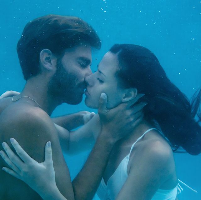 young couple kissing underwater
