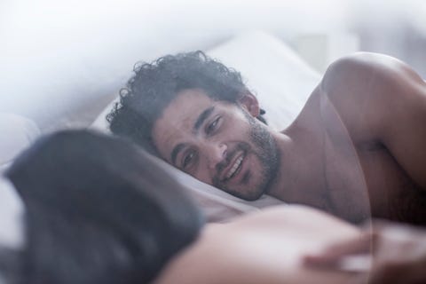 young couple lying in bed