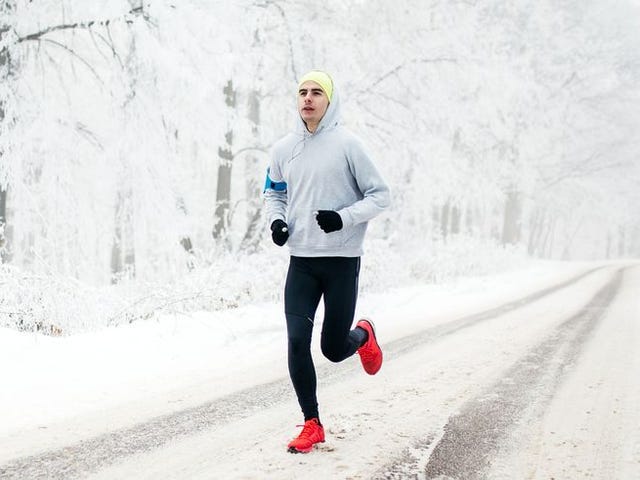 young male runner on the road