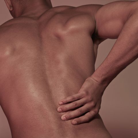 young man having back pains