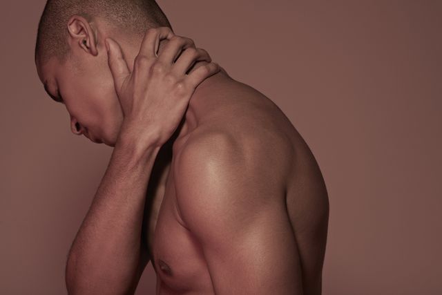 young man having neck pain