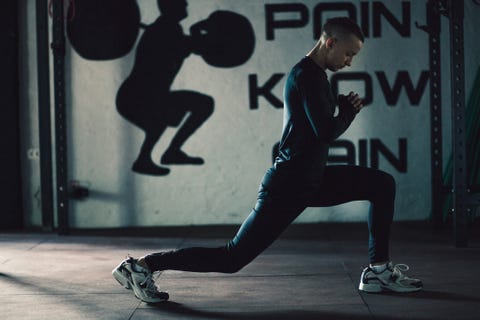 Young man stretching before training