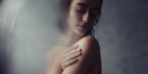 Young sensual woman touching her body