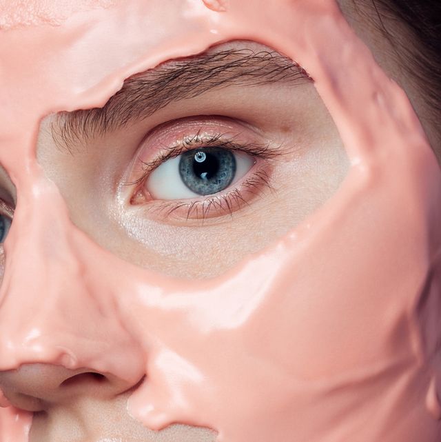 young woman applies beauty mask
