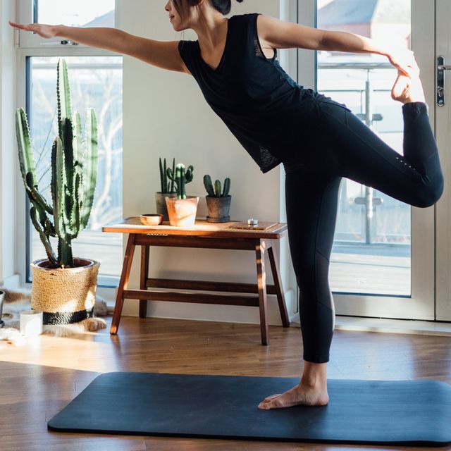 young woman doing yoga exercise at home