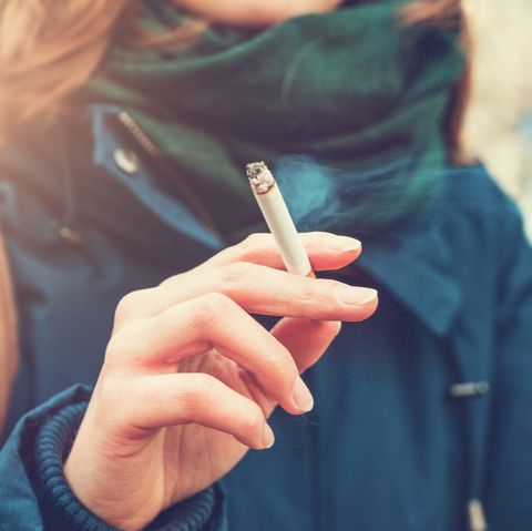 Young woman enjoying a cigarette