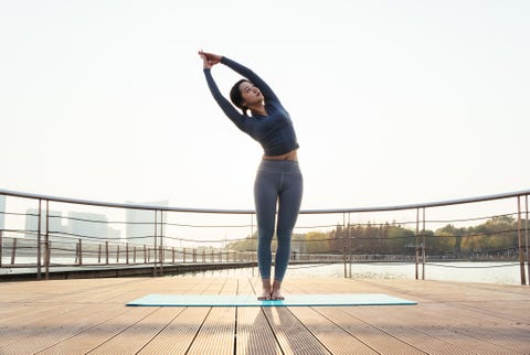 a young woman is practicing yoga