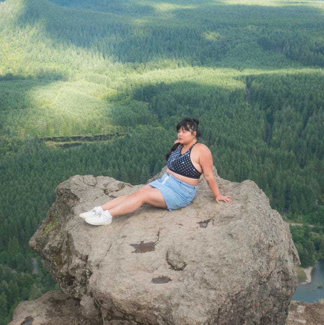 Young Woman On Mountain Top young woman on mountain top