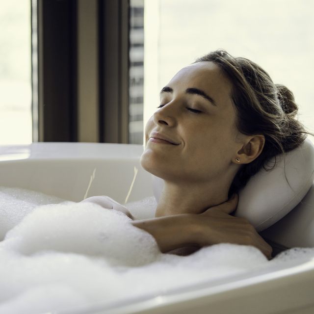 young woman relaxing in bathtub