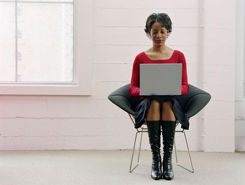young woman using laptop computer
