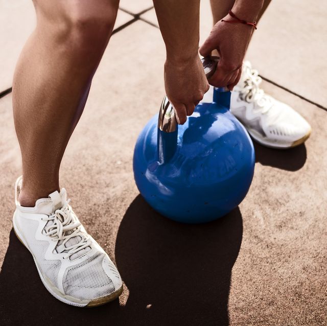 young woman with kettle bell