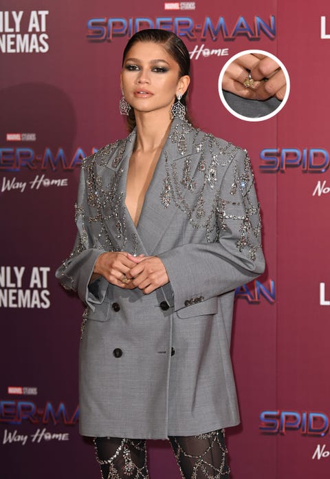 zendaya wearing a yellow diamond ring during her press tour