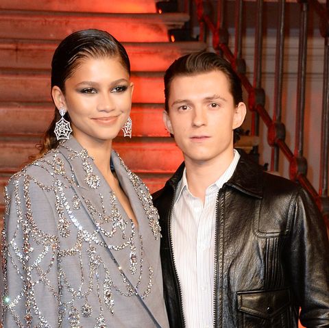 zendaya and tom holland pose by spiderman no way home photocall