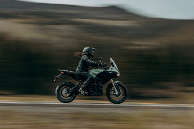 person riding a zero dsrx motorcycle