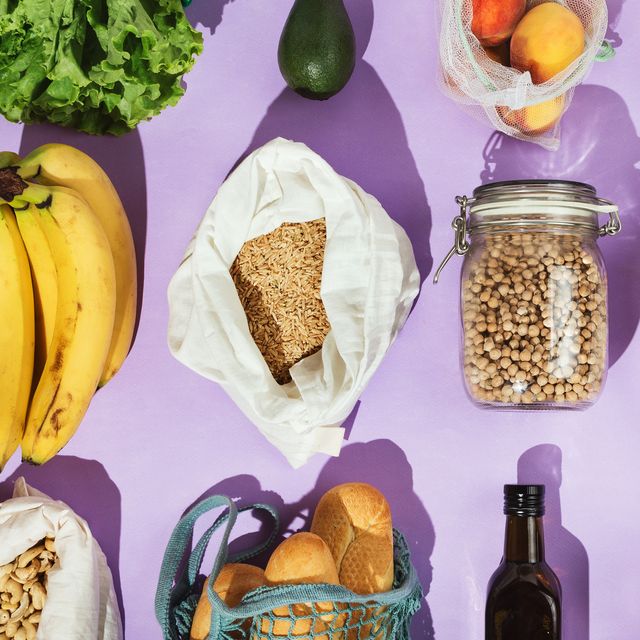 Healthy grocery shopping concept Pulses, fruits and vegetables in mesh or cotton bags and glass containers