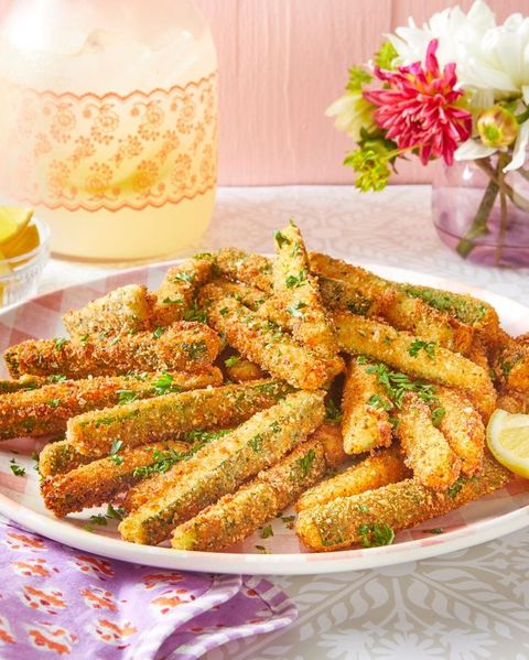 fried zucchini with lemon wedges