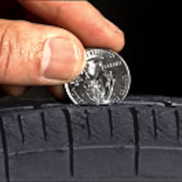 Finger, Automotive tire, Photograph, Tread, Synthetic rubber, Money, Coin, Currency, Photography, Metal, 