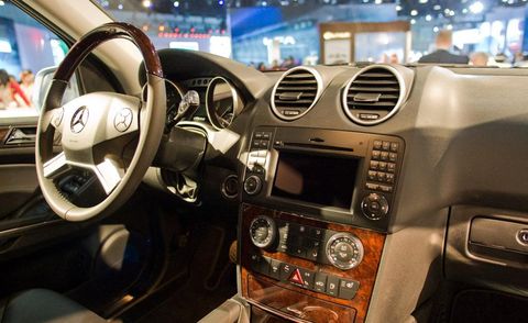Motor vehicle, Steering part, Automotive design, Brown, Steering wheel, Vehicle audio, Electronic device, Center console, Car, Technology, 