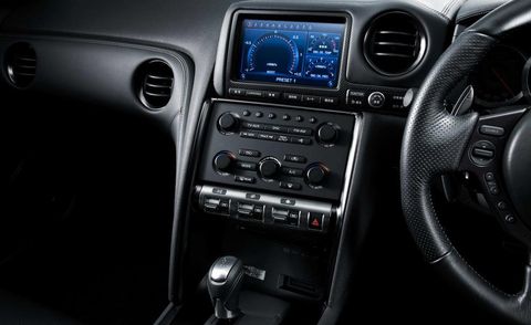 Vehicle audio, Steering part, Center console, Steering wheel, Radio, Electronics, Black, Luxury vehicle, Satellite radio, Gear shift, 