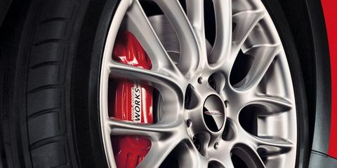 Wheel, Tire, Alloy wheel, Automotive tire, Automotive design, Spoke, Automotive wheel system, Rim, Red, Synthetic rubber, 