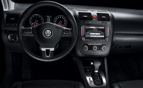 Automotive design, Product, Steering wheel, Steering part, Transport, White, Red, Car, Center console, Luxury vehicle, 