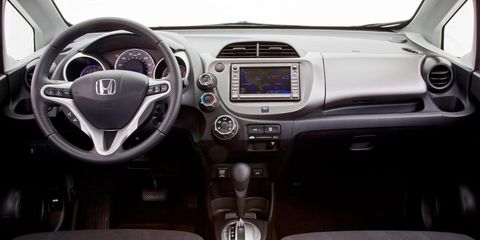 Motor vehicle, Steering part, Mode of transport, Blue, Automotive design, Product, Steering wheel, Transport, Center console, Vehicle audio, 