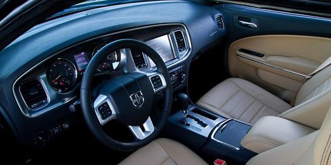 Motor vehicle, Steering part, Steering wheel, Vehicle door, Vehicle audio, Center console, Car seat, Personal luxury car, Luxury vehicle, Fixture, 