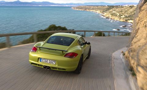 automotive design, yellow, vehicle, road, car, coastal and oceanic landforms, vehicle registration plate, fender, personal luxury car, convertible,