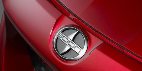 Motor vehicle, Automotive design, Red, Automotive exterior, Logo, Carmine, Symbol, Emblem, Maroon, Trademark, 