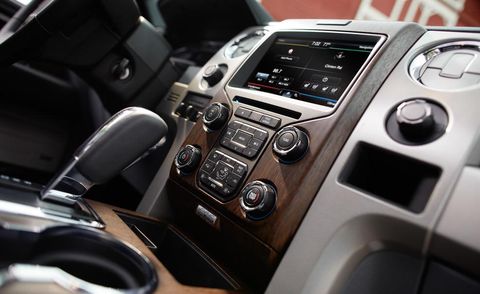 Automotive design, Vehicle audio, Center console, Radio, Steering part, Luxury vehicle, Gear shift, Steering wheel, Electronics, Personal luxury car, 