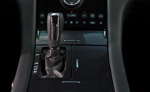 Vehicle door, Fixture, Door, Gear shift, Center console, Door handle, Vehicle audio, Automotive door part, Luxury vehicle, 